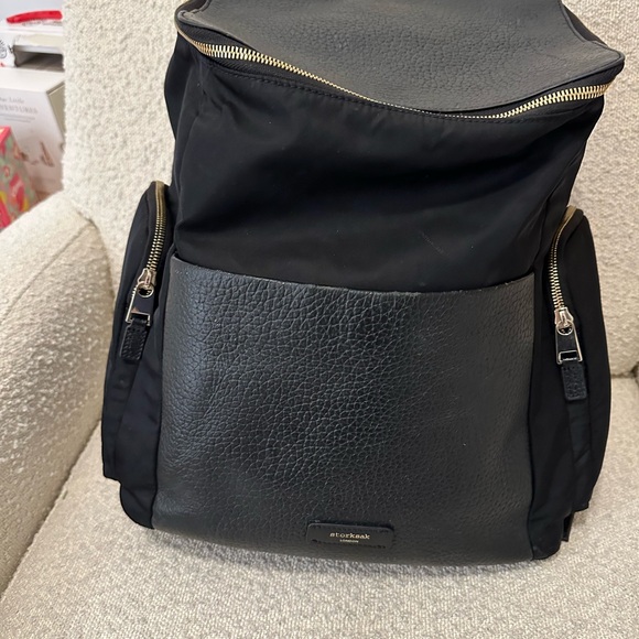 Storksak Handbags - Storksak Black Leather Trim Backpack